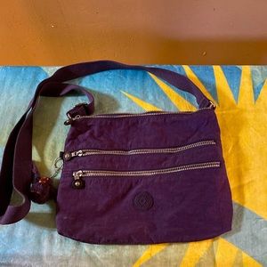 KIPLING PURPLE CROSSBODY BAG.